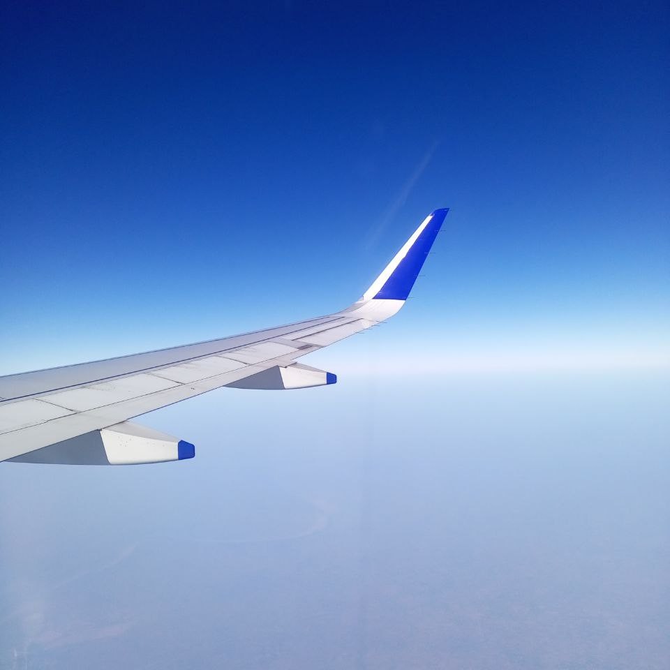 Airplane window view - clear sky